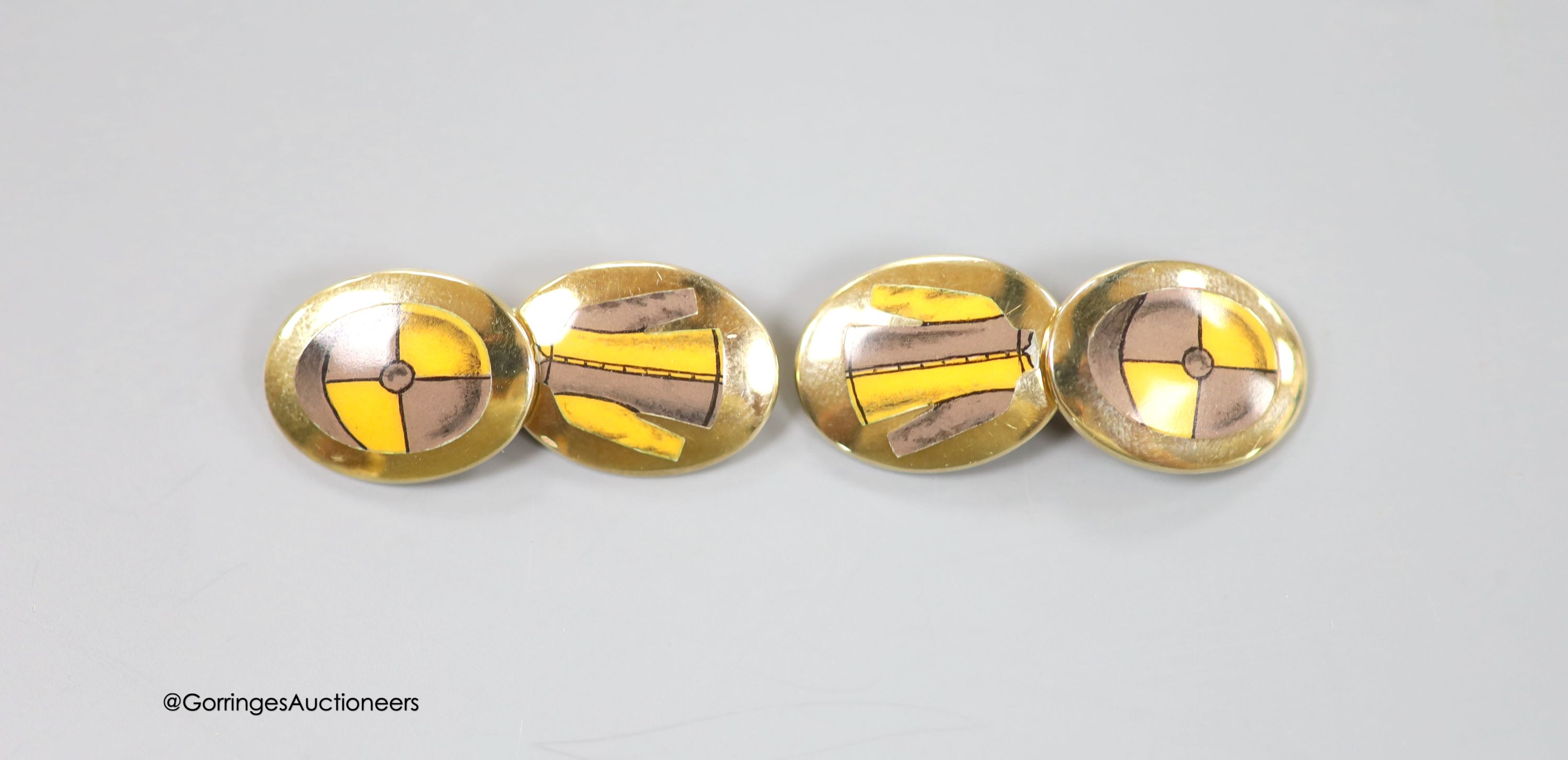 A cased modern pair of silver gilt and enamel Longmire oval cufflinks, decorated with jockey cap and colours, 19mm, gross weight 16.2 grams.